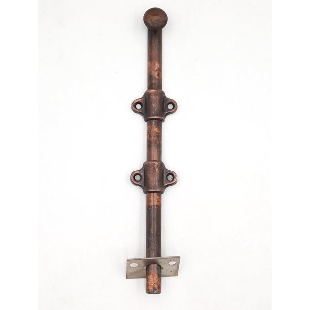 Vintage surface mount slide door bolt made of steel with a japanned finish. The original mounting screws are not...