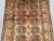 This vintage Afghan hand-knotted rug showcases a stunning example of traditional tribal artistry, blending earthy beige...