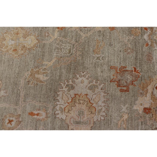 Measures: 12'9 x 18'4 Large Turkish Angora Oushak Rug with Soft Green Field and Rust Accents. Keivan Woven Arts. rug...