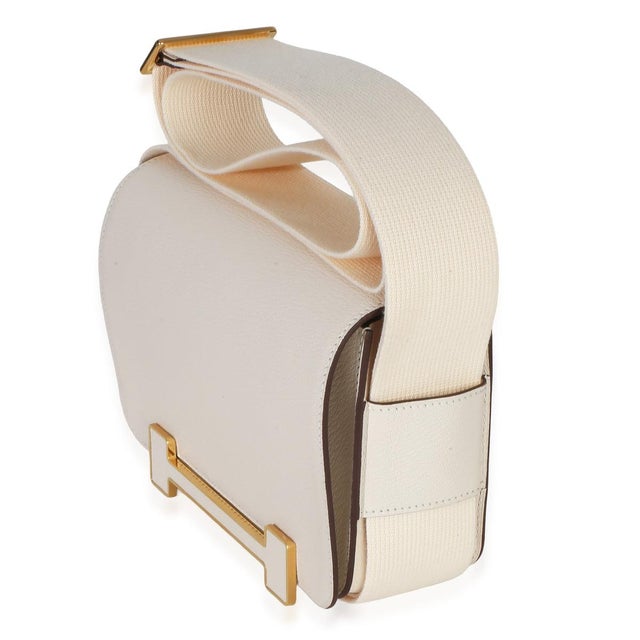 Item #: Z153587 Features Interior: Three slip pockets Dimensions: 7.75 x 5.5 x 2.5 in Handbag Closure Type: Magnetic Strap...