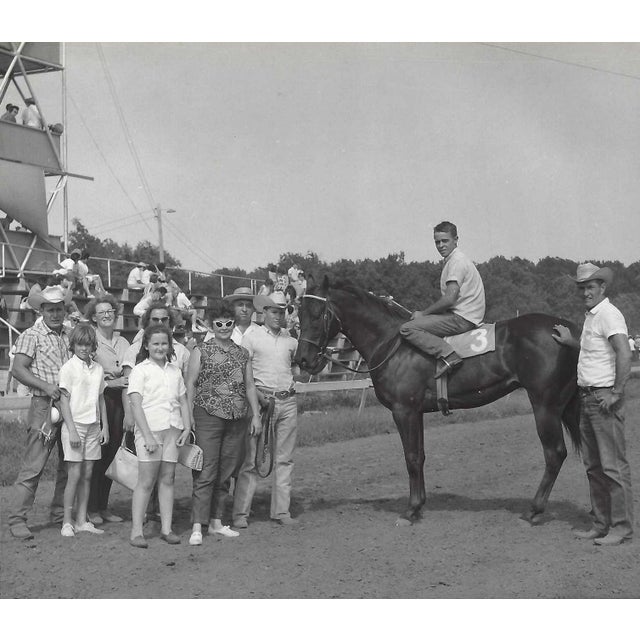 July 1965 black and white photograph of Judge Jr in the winner's circle at Marble Downs in Carthage, Missouri. Jockey Tom...