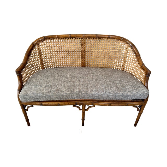 This faux bamboo caned settee is in the Aesthetic Movement style dating to the mid 20th C. The design draws from the...