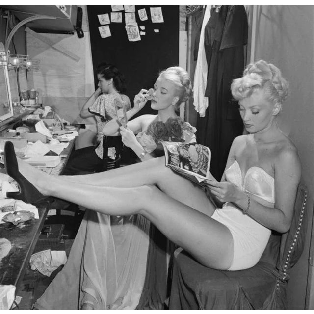 Backstage At La Scala 1948 by Slim Aarons Slim Aarons Limited Estate Edition A chorus girl reads a movie magazine in a...
