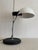 The metal base has been professionally powder-coated in matte black. The original white shade has been carefully cleaned...