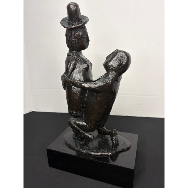 This bronze mid- century figurative sculpture is by Clivia Calder Morrison (1909-2010). The piece mounted on a black...
