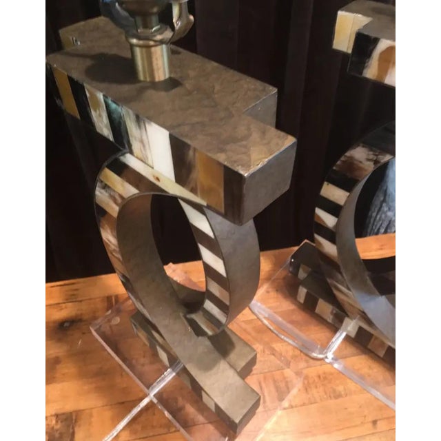 These lamps with faux horn detailing reminiscent of natural veining adds a striking touch of abstract illustration to its...