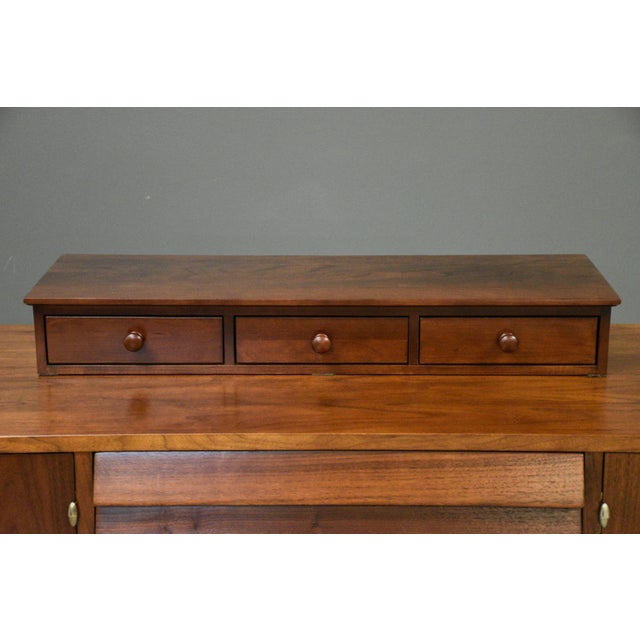 A three drawer solid cherry dresser topper with round knobs made by Ethan Allen American Impressions. Dovetail drawers....