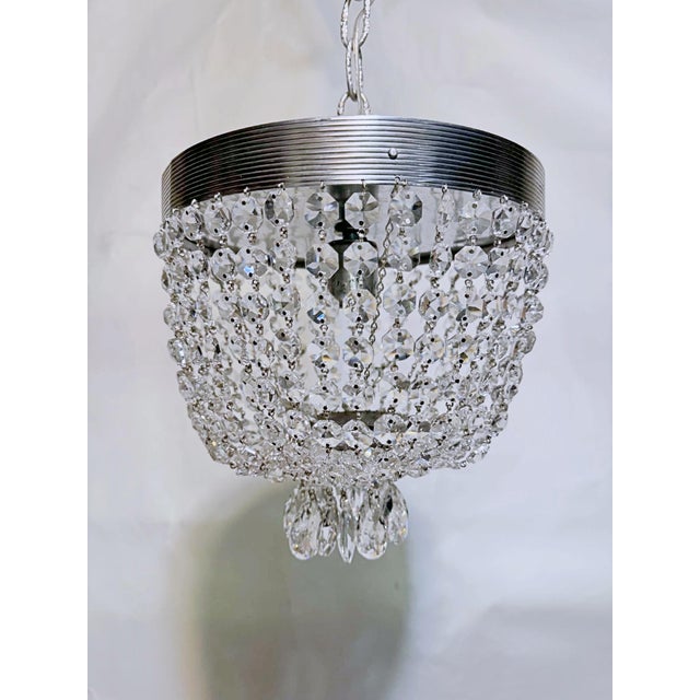 Bring sleek, retro-modern brilliance into your home with this stunning vintage mid-century silver crystal basket...