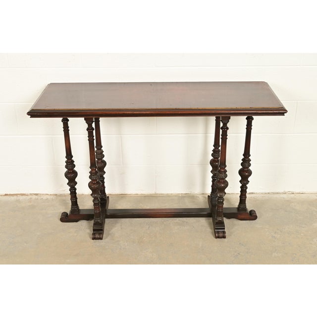 A beautiful antique English Jacobean style console table, sofa table, or buffet server In the manner of Berkey & Gay USA,...