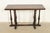 A beautiful antique English Jacobean style console table, sofa table, or buffet server In the manner of Berkey & Gay USA,...