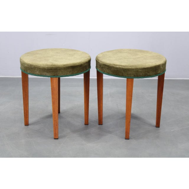 This refined pair of Art Deco stools was produced in Czechoslovakia during the 1940s. The stools combine solid beech wood...