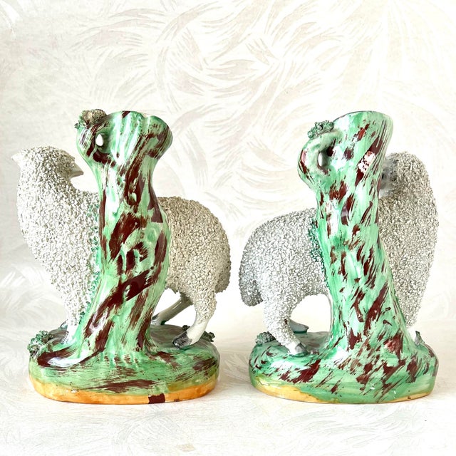 Charming pair of Staffordshire Ware confetti sheep. They look like a couple, male and a female, based on one having...