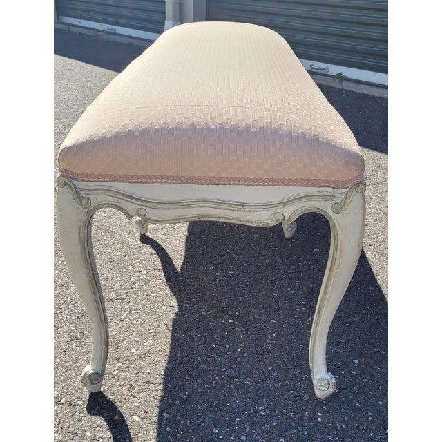 A very nice and elegant long French style window or bedroom foot of the bed bench. Features carved wood painted frame with...