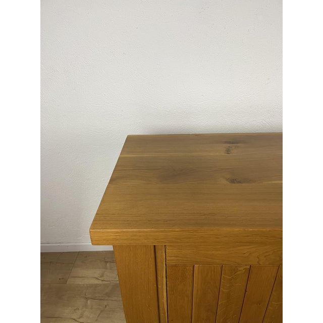 Three-door elm wood sideboard with shelves, Italian-made, from the 1970s. The sideboard has been thoroughly cleaned and...