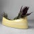 Minimalist Japanese ikebana vase from the 1950s, finished in a soft yellow glaze. Dimensions: height 11.5 cm, width 35 cm,...