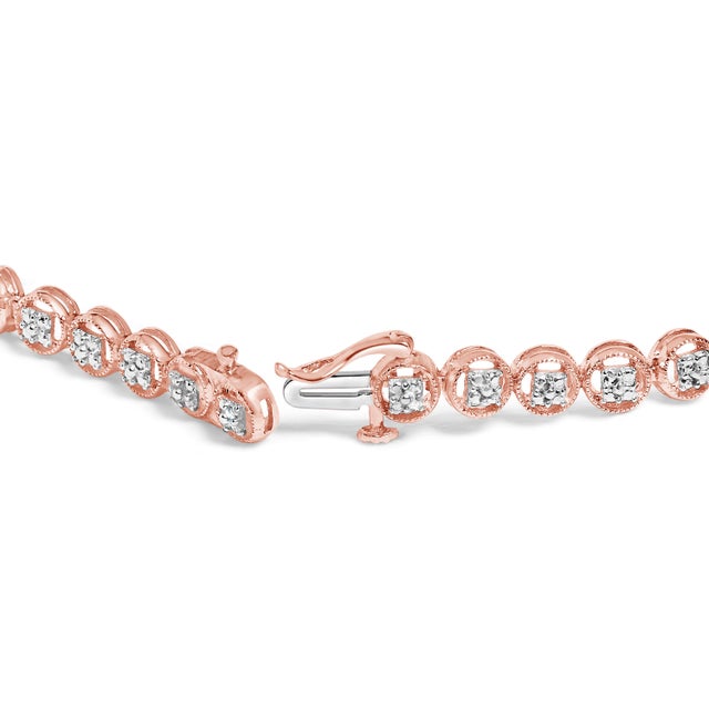Imbued with the glow of 14K rose gold plating over impeccable .925 sterling silver, this tennis bracelet marries modern...