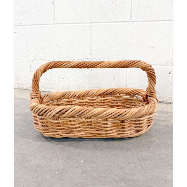 Crafted from natural twigs, this charming vintage basket exudes rustic, timeless appeal. Its oval silhouette and twisted...