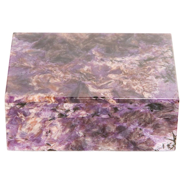 This exquisite Charoite Box (3.5" x 4.25") is crafted from a rare and mesmerizing purple-hued mineral found exclusively in...