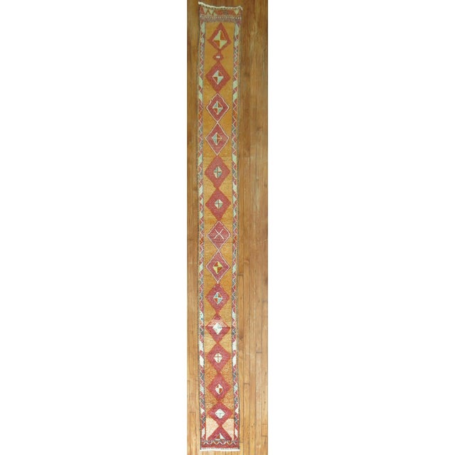 A mid-20th century geometric skinny Turkish runner. Measures: 1'3'' x 12'11''.
