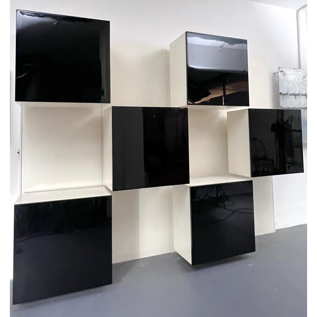 Very good vintage condition with normal trace of age and use for this modular bookcase designed by Roberto Monsani for...