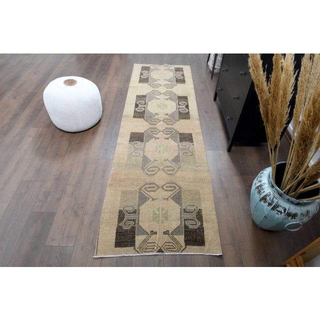 Vintage Persian Hand-Knotted Runner rug is a semi-antique vintage Runner rug. The '70s Eastern region of Anatolian's...