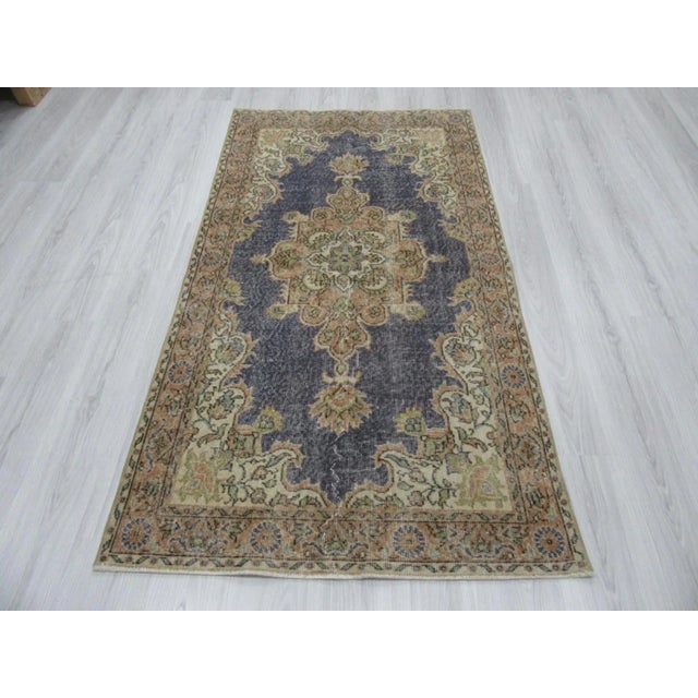 Vintage small rug from the Oushak region of Turkey. Approximately 45-55 years old. In very good condition.