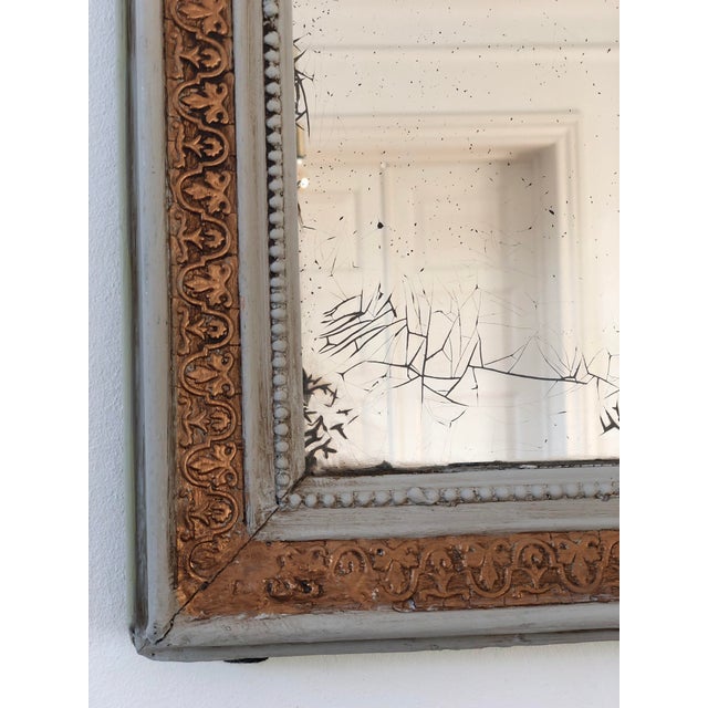 Large Antique French Louis Philippe mirror, dating to the late 19th century. The mirror features a cream-painted wooden...