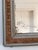 Large Antique French Louis Philippe mirror, dating to the late 19th century. The mirror features a cream-painted wooden...