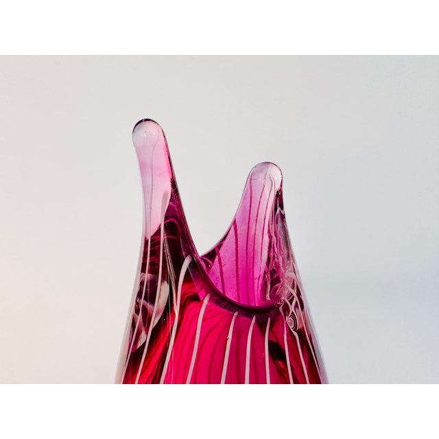 Scandinavian art vase in vibrant fuchsia pink with white filigree decoration. The elegant, organic form with its elongated...