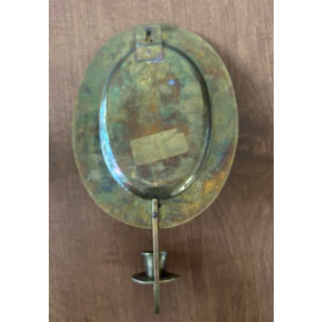 Mid century solid brass candle sconce with glass votive. Can be used with or without glass votive holder. Without you can...