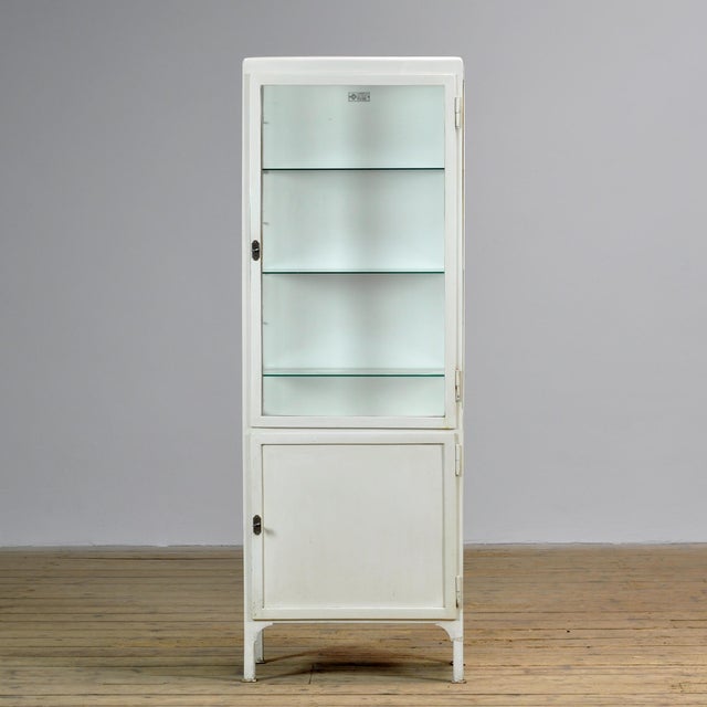 This Polish medicine cabinet from 1975 combines functional industrial design with a historical look. Manufactured by...