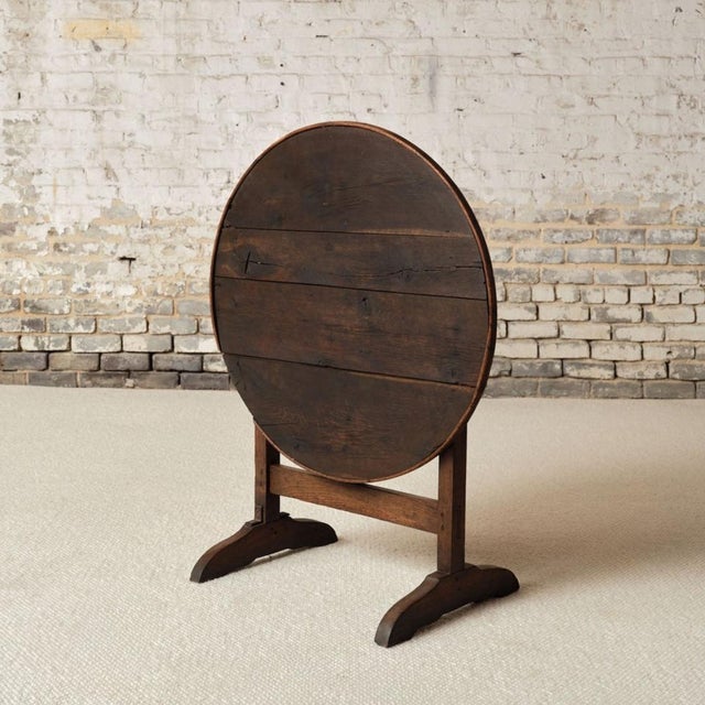 This 19th century French oak table de vin is a charming and versatile antique, crafted from solid oak with a beautifully...