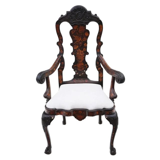Experience the exquisite craftsmanship of this very fine quality 18th Century Dutch marquetry elbow arm or desk chair, a...