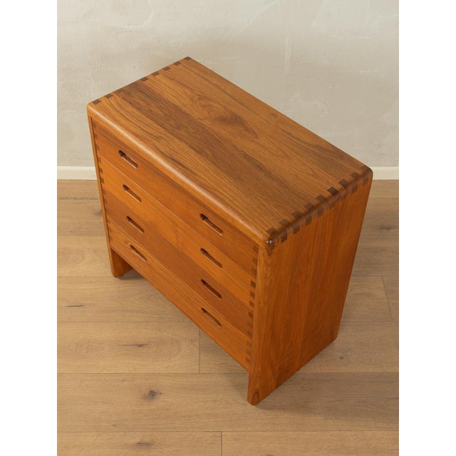 Classic chest of drawers by Niels Bach from the 1960s. High-quality solid teak frame with four drawers and straight legs....