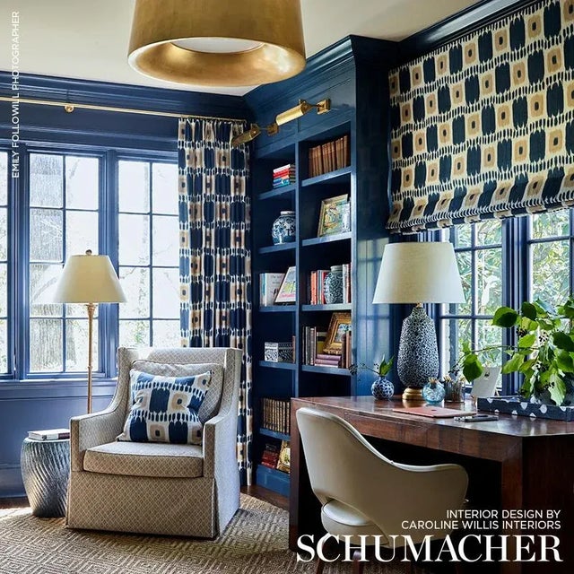 Kandira features a graphic pattern derived from woven ikats. A painterly checkerboard design with tonal variations and a...