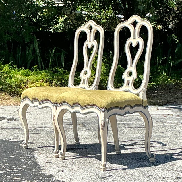Elevate your dining space with this stunning set of 2 Vintage Regency Niermann Weeks Queen Anne Dining Chairs. Featuring...