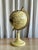 Stunning beige globe with real inlaid gemstones from the 1990s. A fascinating and beautiful piece, which has the perfect...