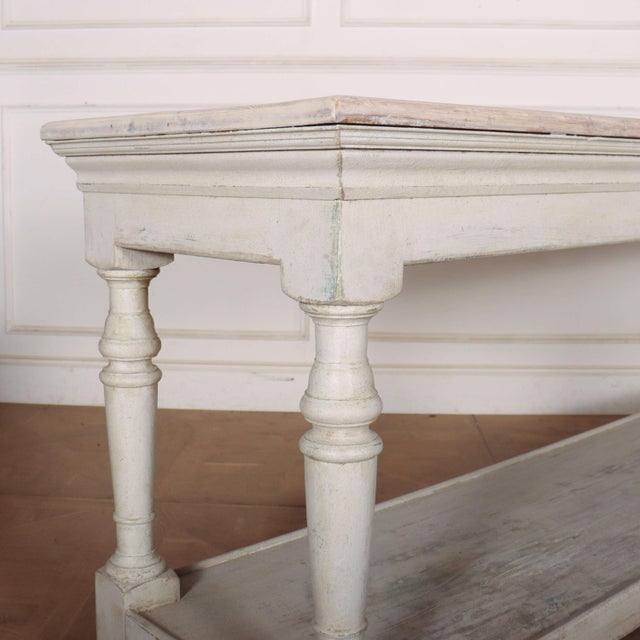 Late 19th century French potboard drapers table/ console table with a scrubbed and bleached pine top. 1890. This piece is...