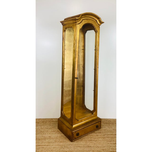 Vintage 1960s Hollywood Regency Display Case / Cabinet made of wood with antiqued gold leaf surface glass on 3 sides front...