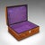 This is an antique Sorrentoware keepsake box. An Italian, walnut and silk cotton lined dressing table case, dating to the...