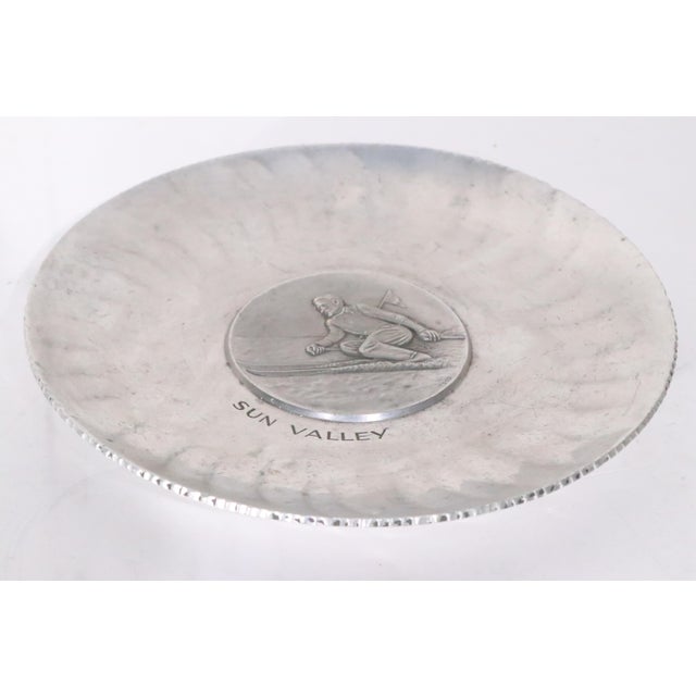 Metal Early 20th Century Souvenir Art Deco Sun Valley Skier Aluminum Plate Made in Switzerland Marked Sigg For Sale - Image 7 of 8