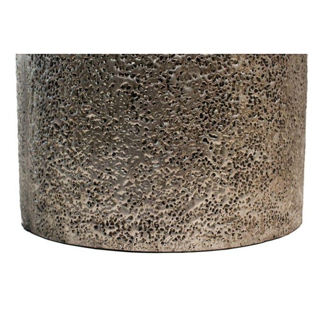 Silver hand-hammered accent table. Add a little style and texture to any room. Place the table in a corner with a plant or...