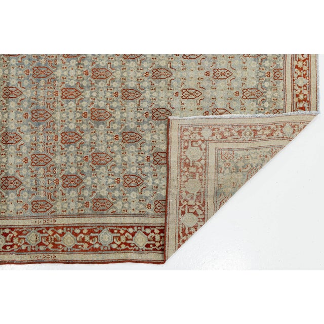 This stunning antique Agra rug from North India features a sophisticated, understated palette of pale celadon blue, ivory,...
