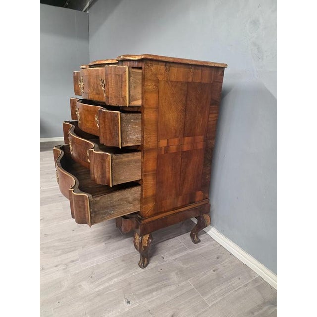 An exquisite piece of furniture with a timeless design. Crafted from high-quality walnut, this chest features 4 drawers...