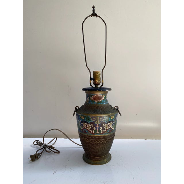 Unique Asian metal lamp with beautiful detail Be a great accent for desk or side table. Nice patina the base of lamp is...