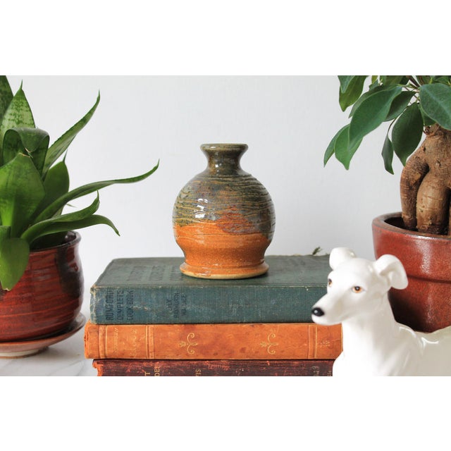 Vintage glazed studio art pottery bud vase. Signed by artist on bottom. No chips or cracks.