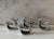 Set of 4 pewter silver napkin rings in the shape of a fish.