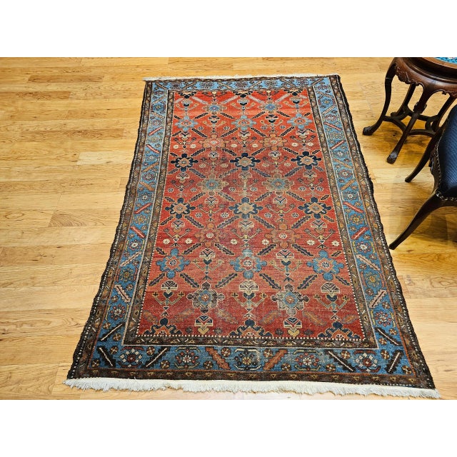 This exquisite vintage Persian Malayer rug, handwoven in the early 20th century, features a striking all-over geometric...