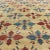 Measures: 6'5 x 11'5 Set on a pale yellow background, this unique Turkish Oushak rug displays an all-over mid-century...