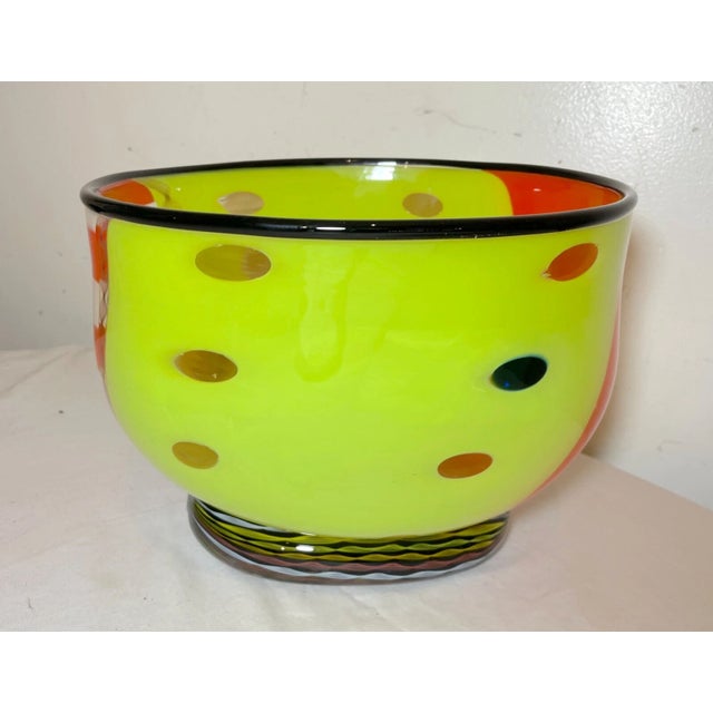 Elevate your space with the striking presence of this exquisitely large hand-blown glass centerpiece bowl, a true...